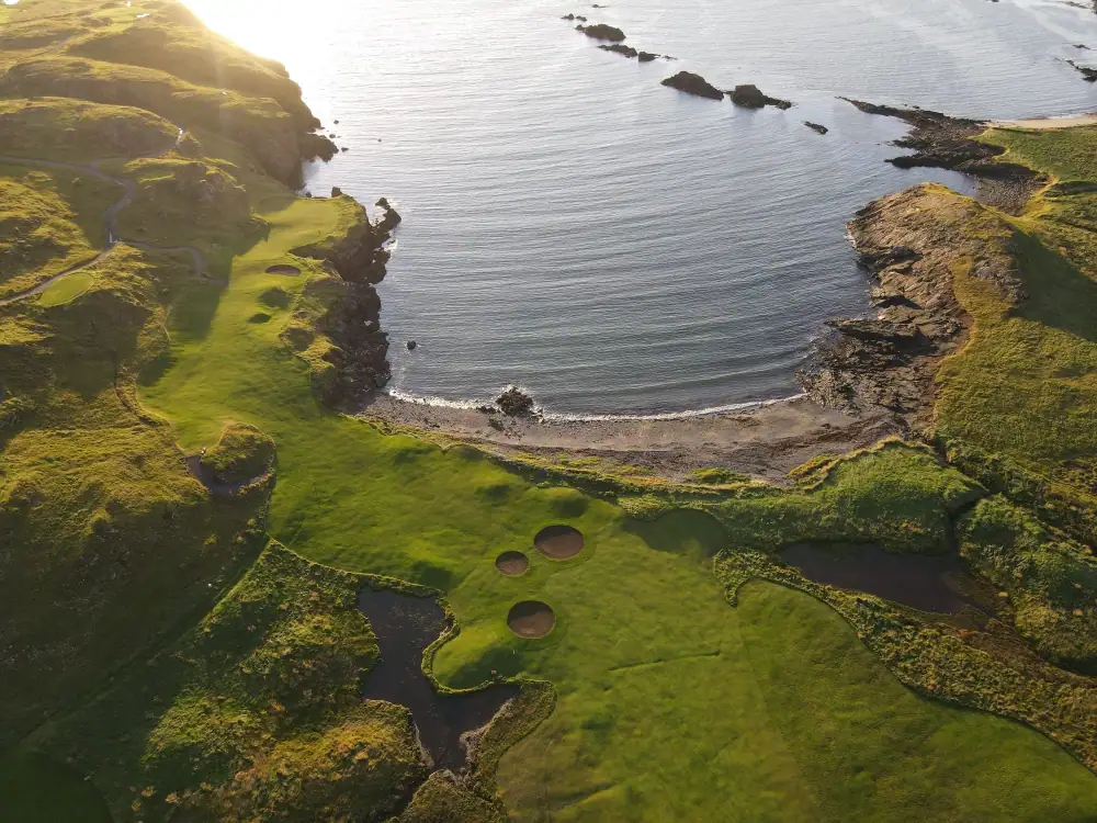 Bay with three pot bunkers and fairway seen from above